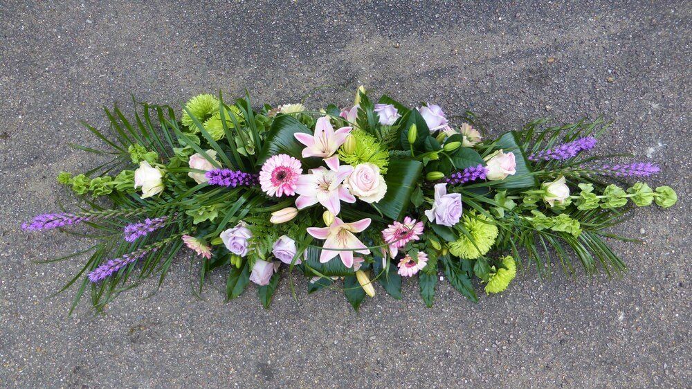 46. Spray with Liatris, lilac and pink Roses, Lily’s, Germini, Mollucella and green Chrysanthemums