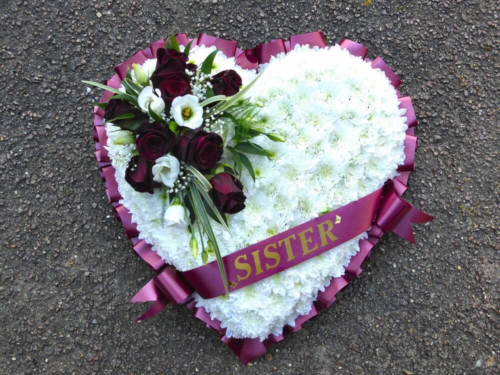 17. White Heart with burgundy ribbon edge and sash. Black Roses and white Lisianthus posy