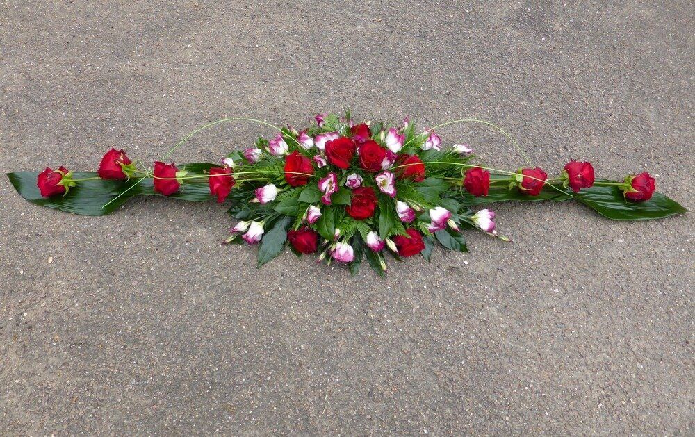 39. Modern full coffin spray of extra large Roses and two tone Lisianthus