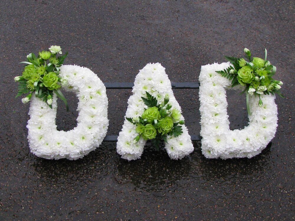21. White clipped DAD letters with green Rose posies