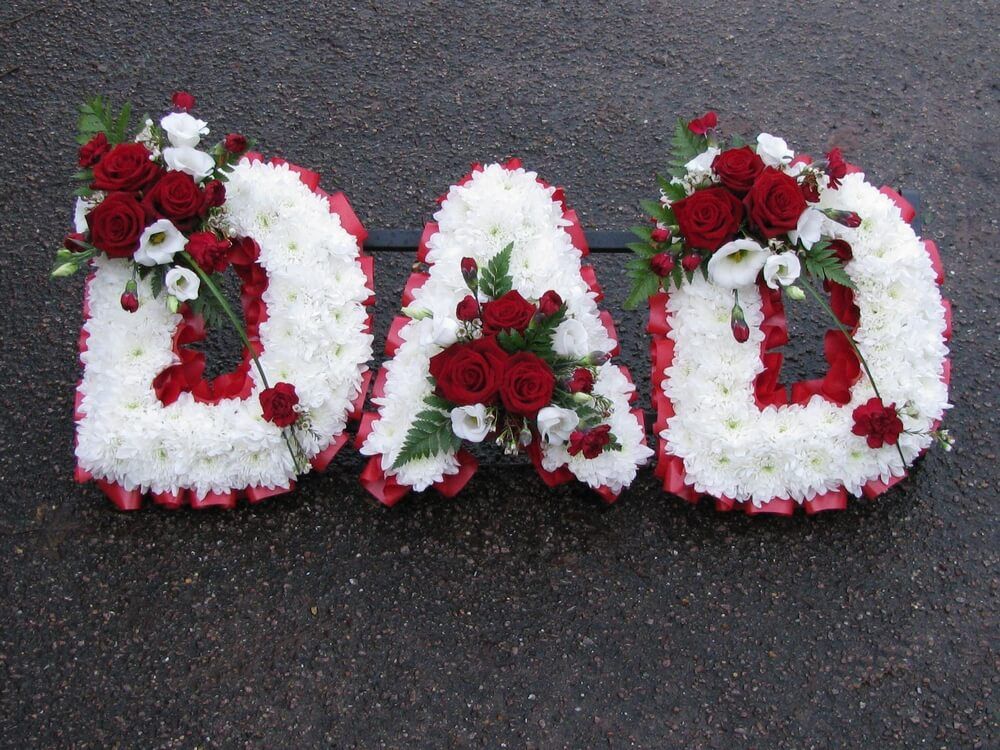 23. DAD with white letters,  red Roses and white Lisianthus posies