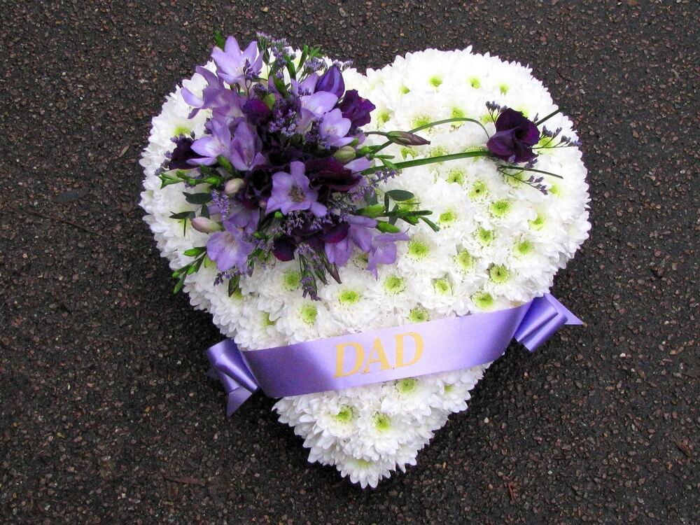 14. White Heart with ribbon sash, posy of lilac Freesias and purple Lisianthus