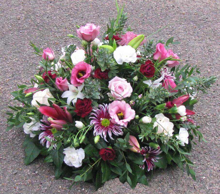 22.  12” Posy with deep pink and deep red and white flowers