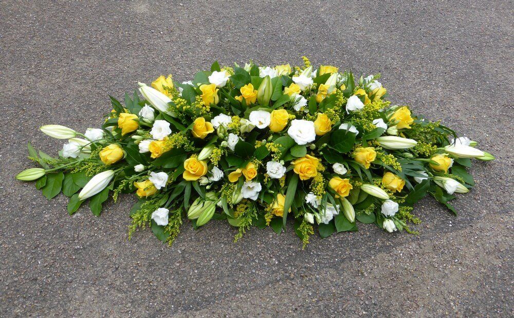 33. Yellow and white spray of Lily’s, Roses, Lisianthus and Golden Rod