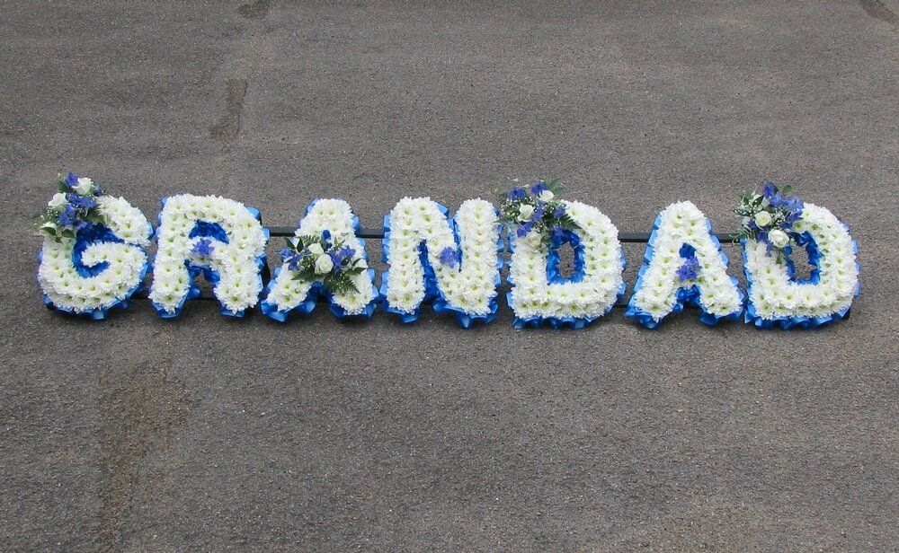 15. Blue and white Grandad with white letters. Blue Delphinium and white Rosebud posies