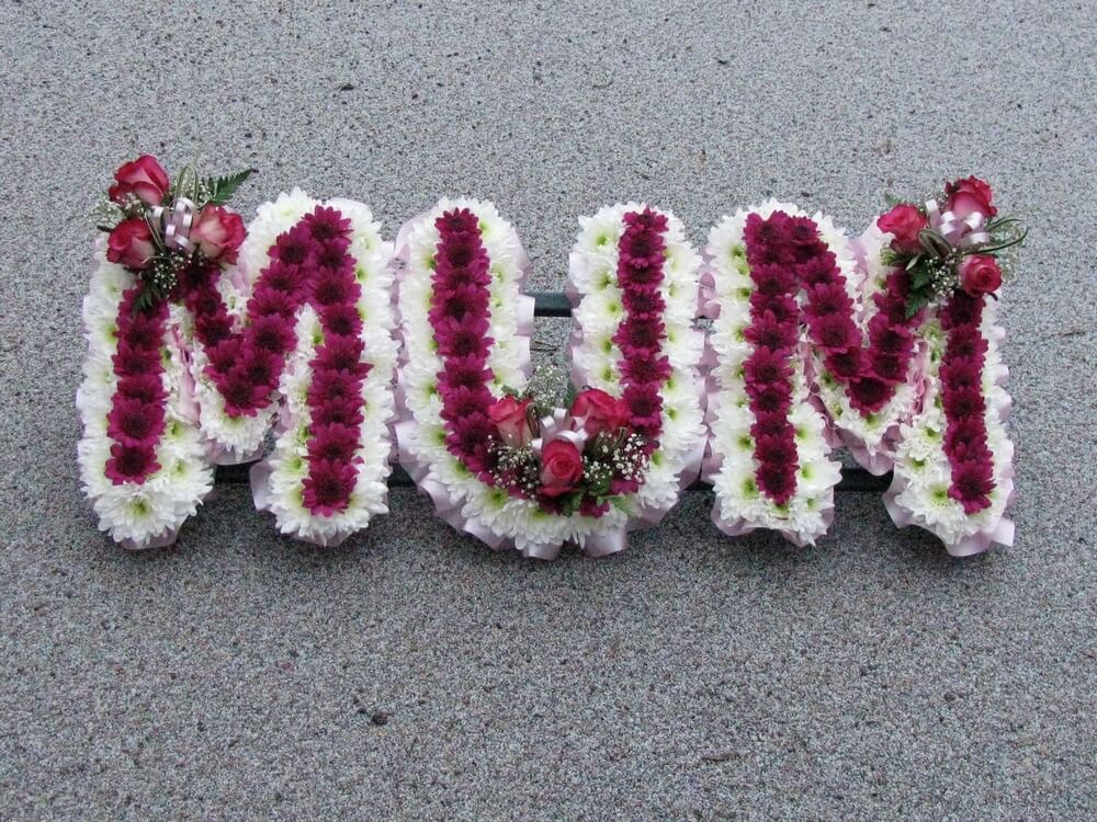 14. Pink and white MUM with deeper pink flowers to the centre of each letter and small Rosebud posies