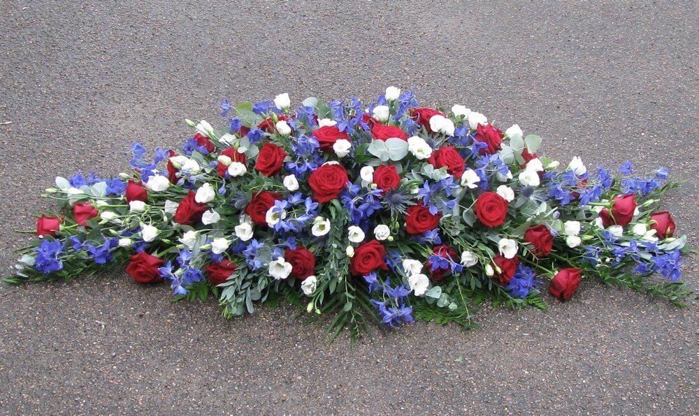 28. Red, white and blue spray of Roses, Delphiniums, Thistles and Lisianthus