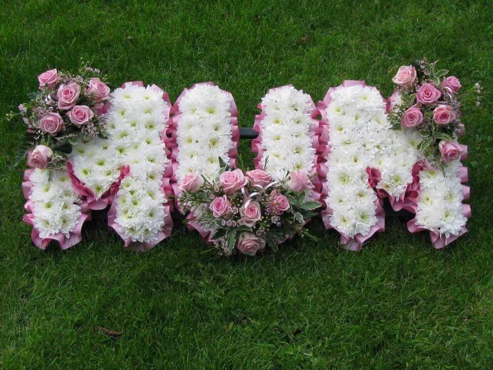 11. Beautiful white and pink MUM letters with pale pink Roses and Waxflowers