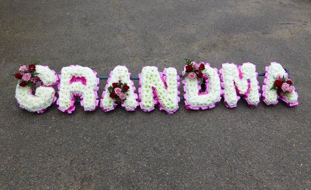 9.  White set GRANDMA letters with red and pink Rose posies on every other letter