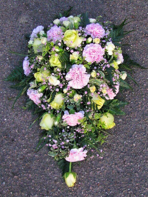 15. Lemon Roses and pink Carnations with Gypsophila in this single ended spray