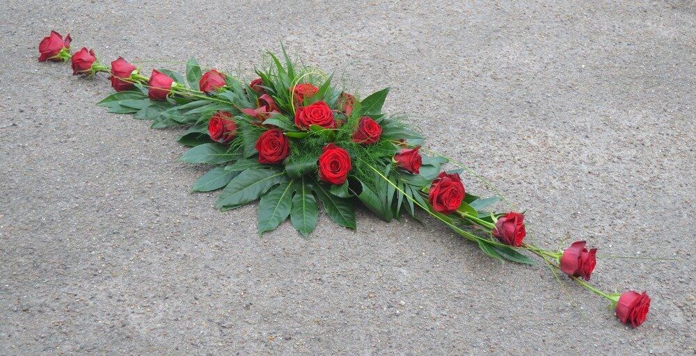 20. Modern full coffin spray with extra large Red Roses