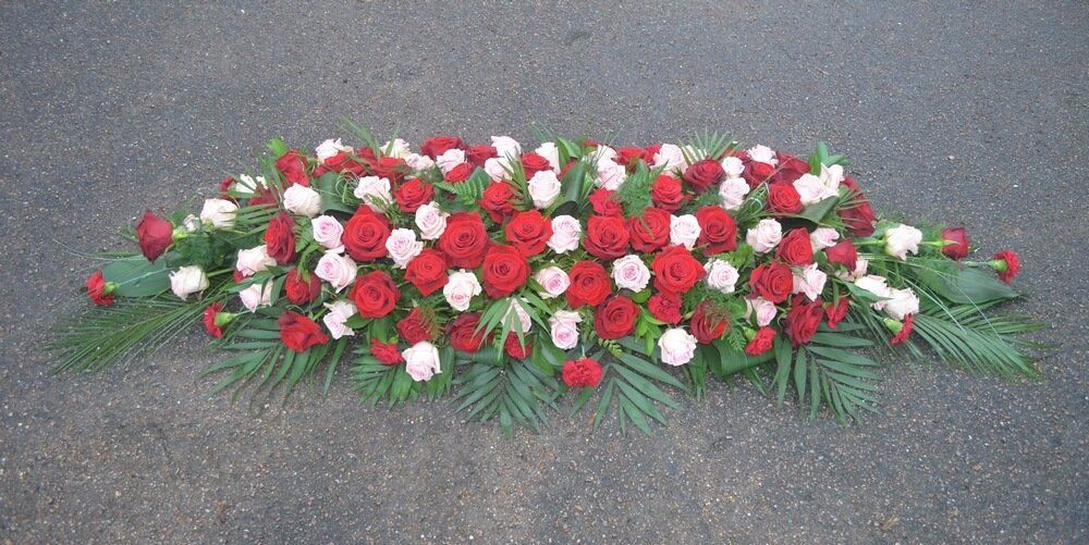 22. Full coffin spray of red and pink Roses
