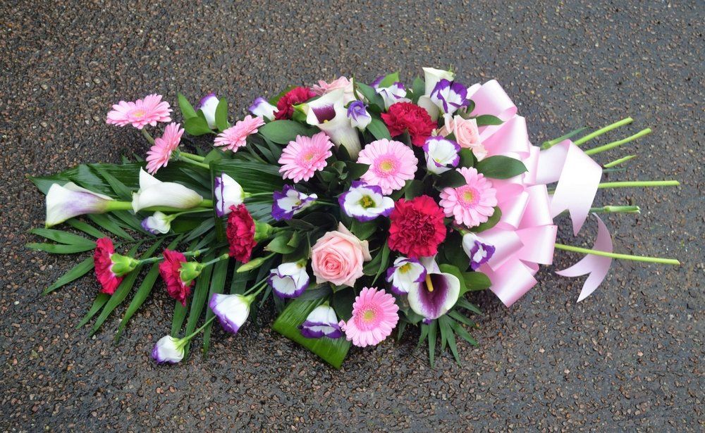 5.  Spray with Callas, Germini, Lisianthus, Roses and Carnations