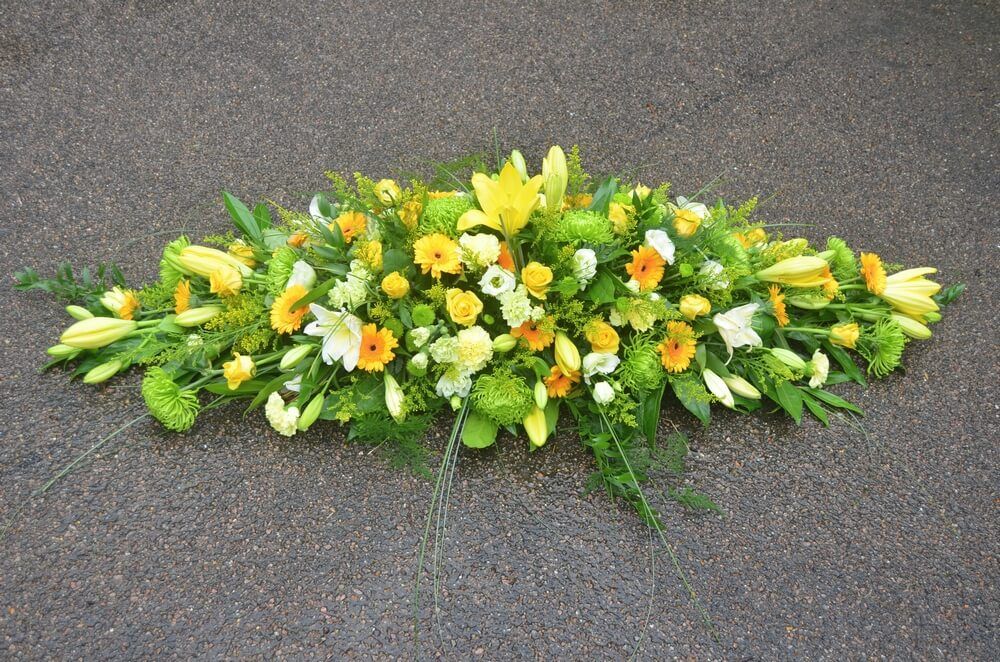 16. Full Coffin Spray of yellow Roses, Lily’s and Germinis with Green Anastasia Chrysanthemums and Lisianthus