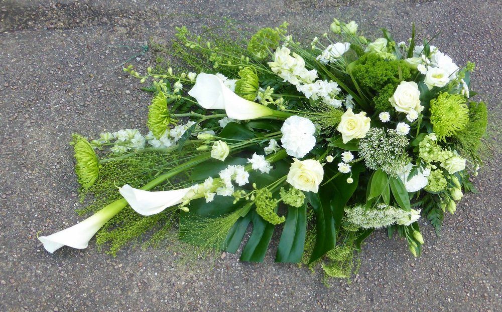 7.  Natural single ended spray with Callas, Roses, Larkspur, Trachelium, Guelder Rose, Chrysanthemums, Panicum Grass