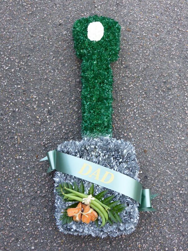 44. Spade with ribbon sash and vegetables