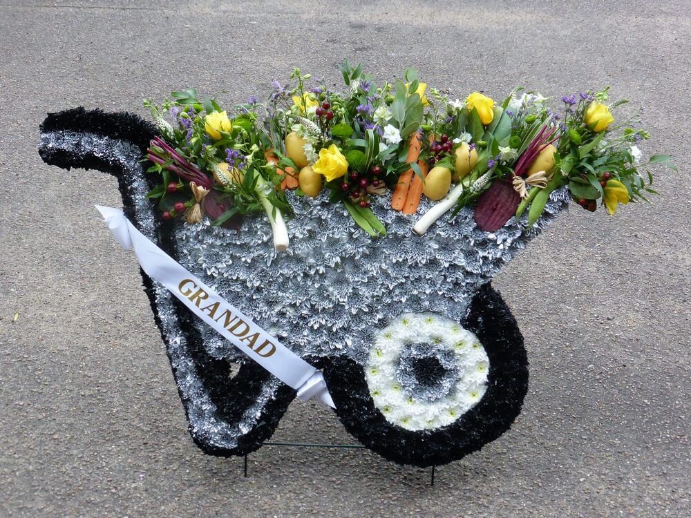 68. 2’ x 3’ Wheelbarrow with ribbon sash, Vegetables and Flowers
