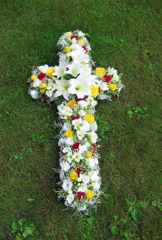 12. 3ft Cross in red, white and yellow with central posy of white Lilys