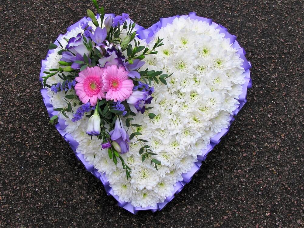 24. White Heart with purple ribbon edge, purple and pink posy
