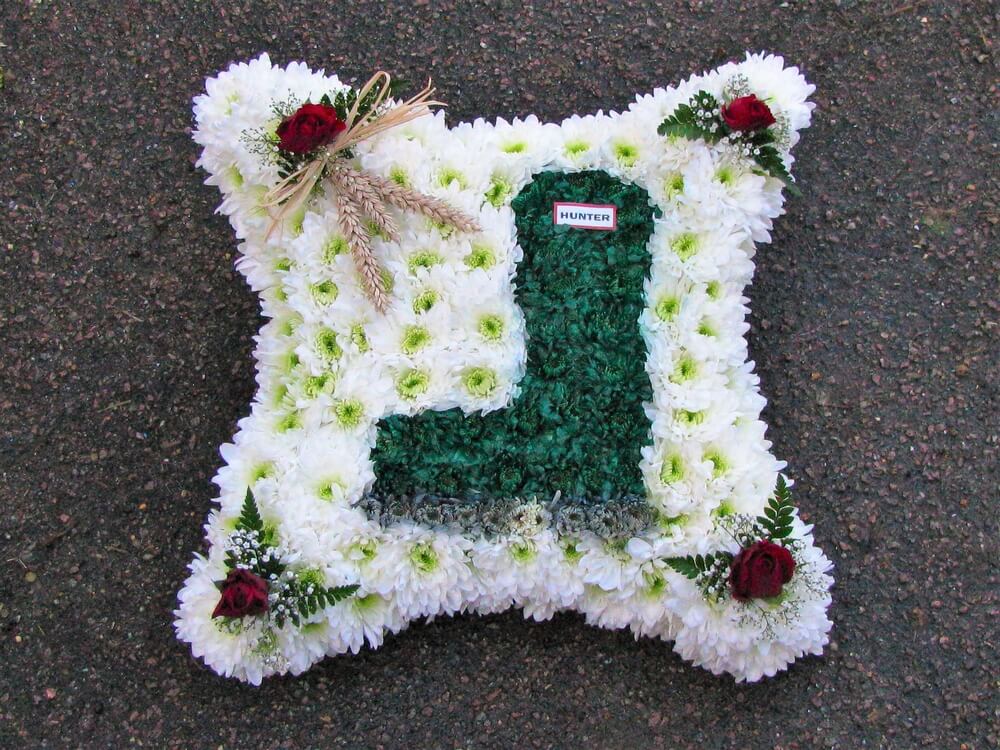 8. 15” white Cushion with custom made Hunter Wellie Boot, red Rose posies in each corner and Farmers own Wheat