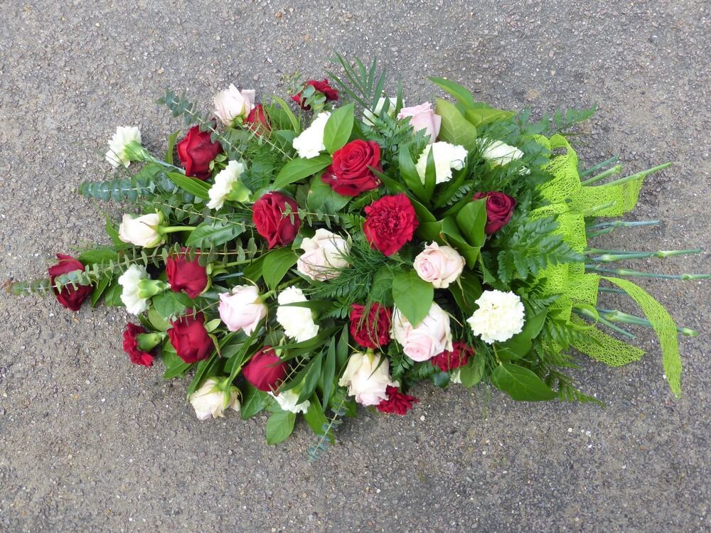 43. Spray of palest pink Roses and Carnations with deeper red Roses and Carnations