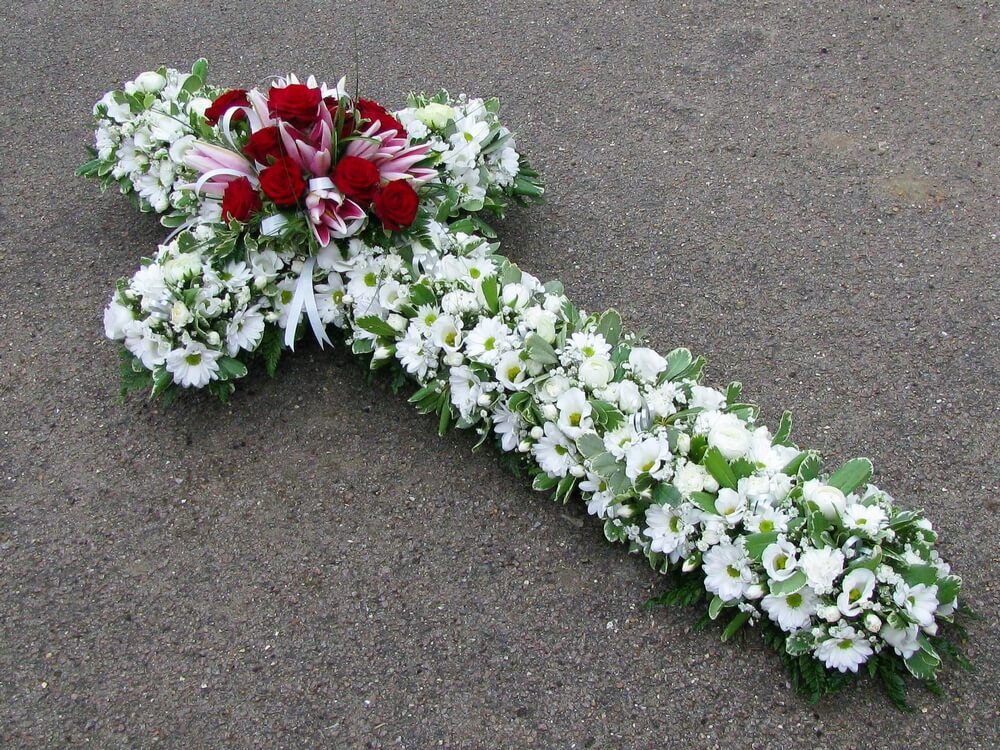 11. 4ft Cross in white with central posy of pink Lilys and red Roses