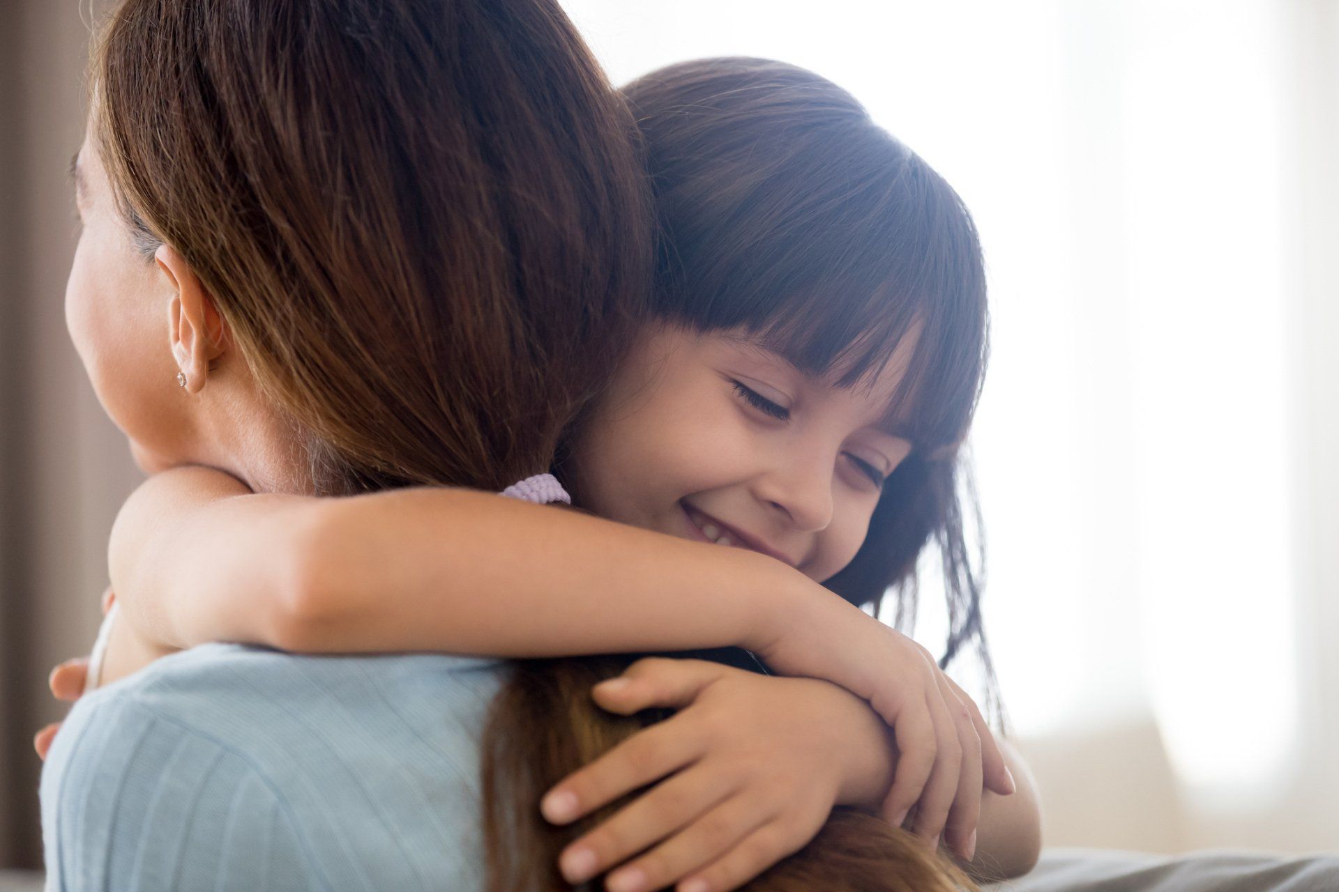 Little Girl Hugging Her Mom — Richmond, VA — Janet E. Brown PC