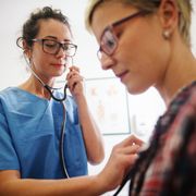 Doctor Using Stethoscope to Examine Patient — Omaha, NE — Arbor Heights Family Medicine Doctor Using Stethoscope to Examine Patient — Omaha, NE — Arbor Heights Family Medicine