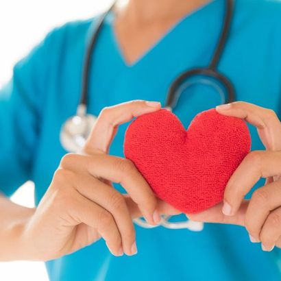Doctor Hands Holding Red Heart — Omaha, NE — Arbor Heights Family Medicine Doctor Hands Holding Red Heart — Omaha, NE — Arbor Heights Family Medicine