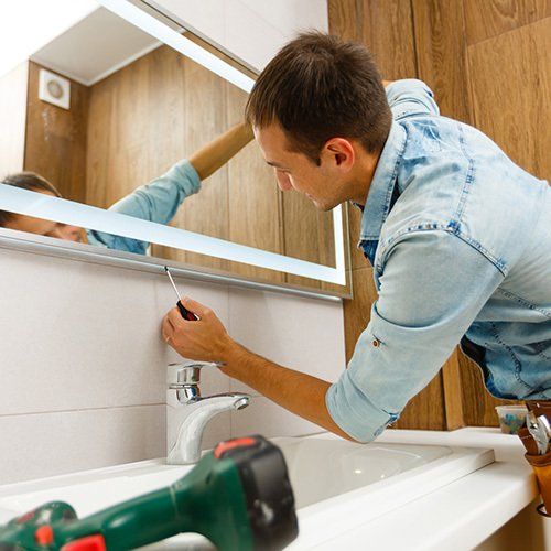 A Man Installing Mirror — Pasadena, CA — A & S Glass and Mirrors