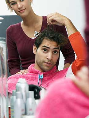 Man instructing stylist on length of desired hair cut in Lakewood, WA Man instructing stylist on length of desired hair cut in Lakewood, WA