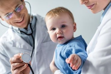 Infants — Infant Baby Getting Examined by Doctor in Asheville, NC