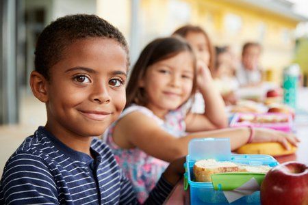 Children's Doctor — Smiling Kids in Front of Table in Asheville, NC
