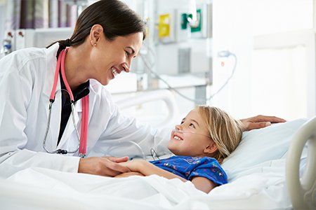Children's Physician — Child and Doctor Smiling in Asheville, NC
