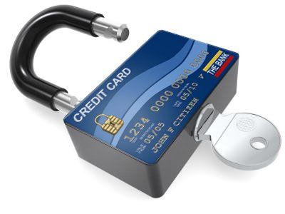 A padlock with a credit card on it and a key