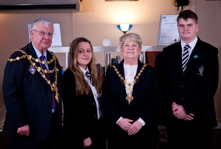 Newport Mayor Councillor Cliver Suller with the Mayoress posing for a picture including two highschool students whilst visiting DEZINES Internet Solutions Limited's commercial premises.