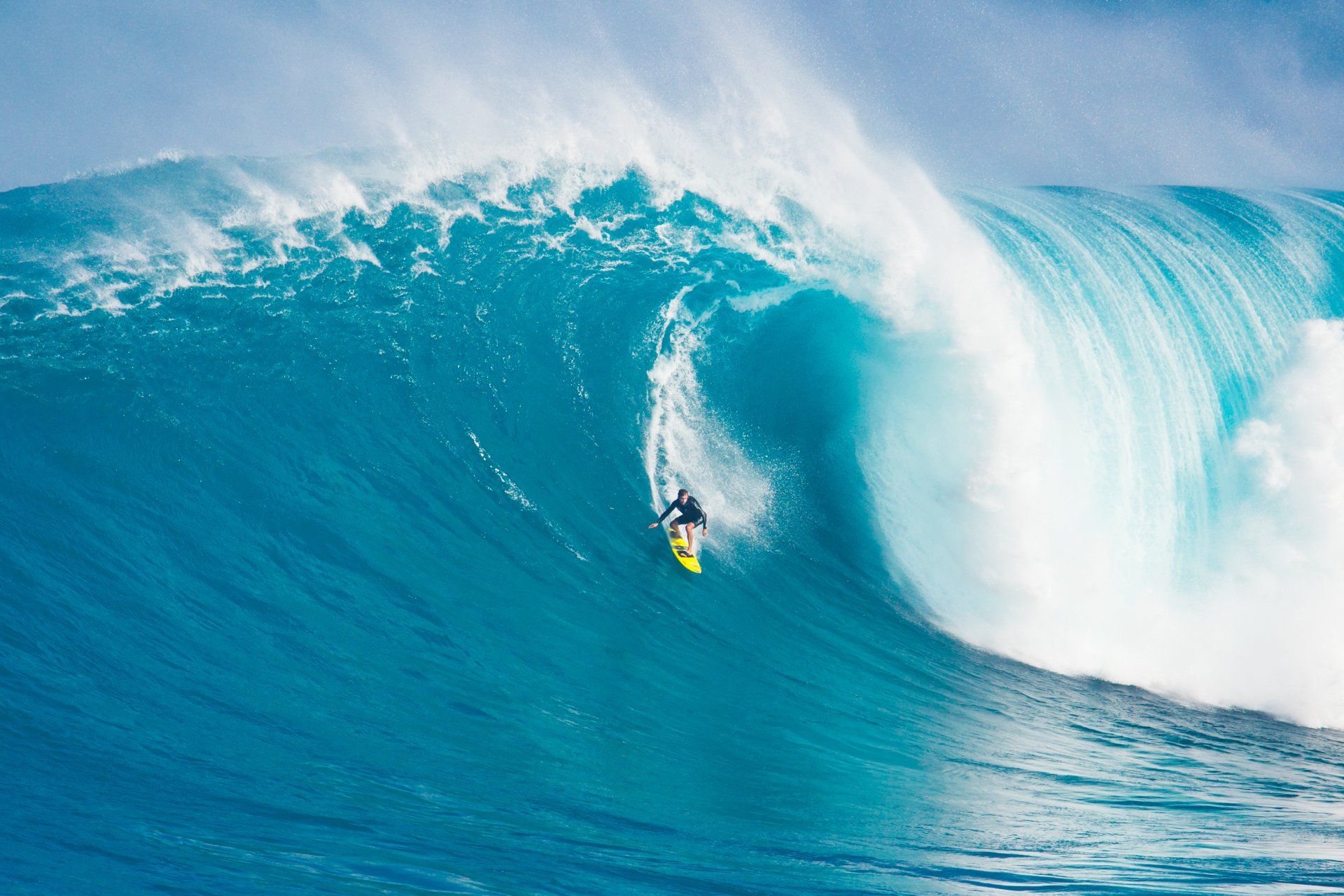 A surfer is riding a large wave in the ocean
