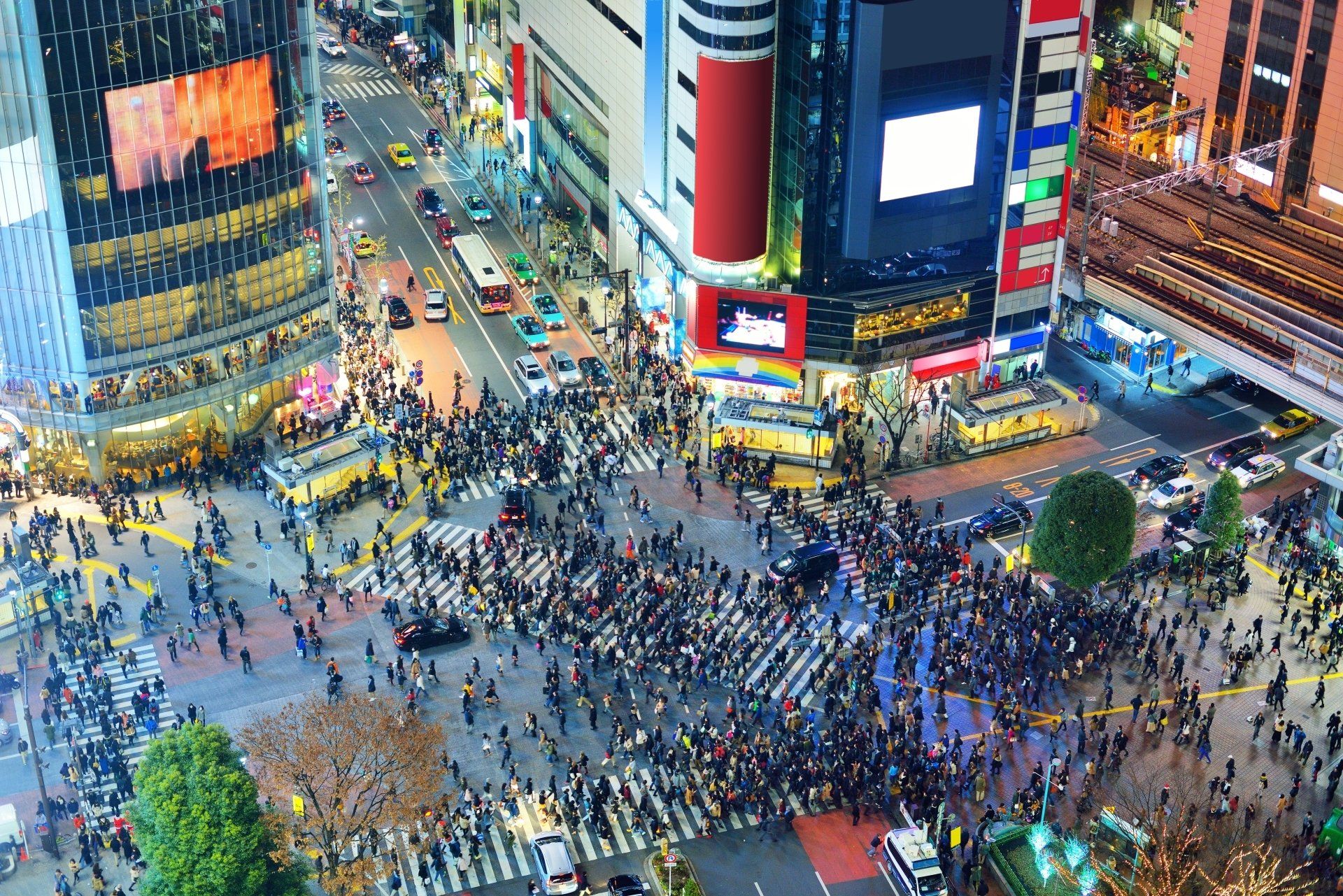 An aerial view of a Shubaya Square, Tokyo city intersection with neon signs