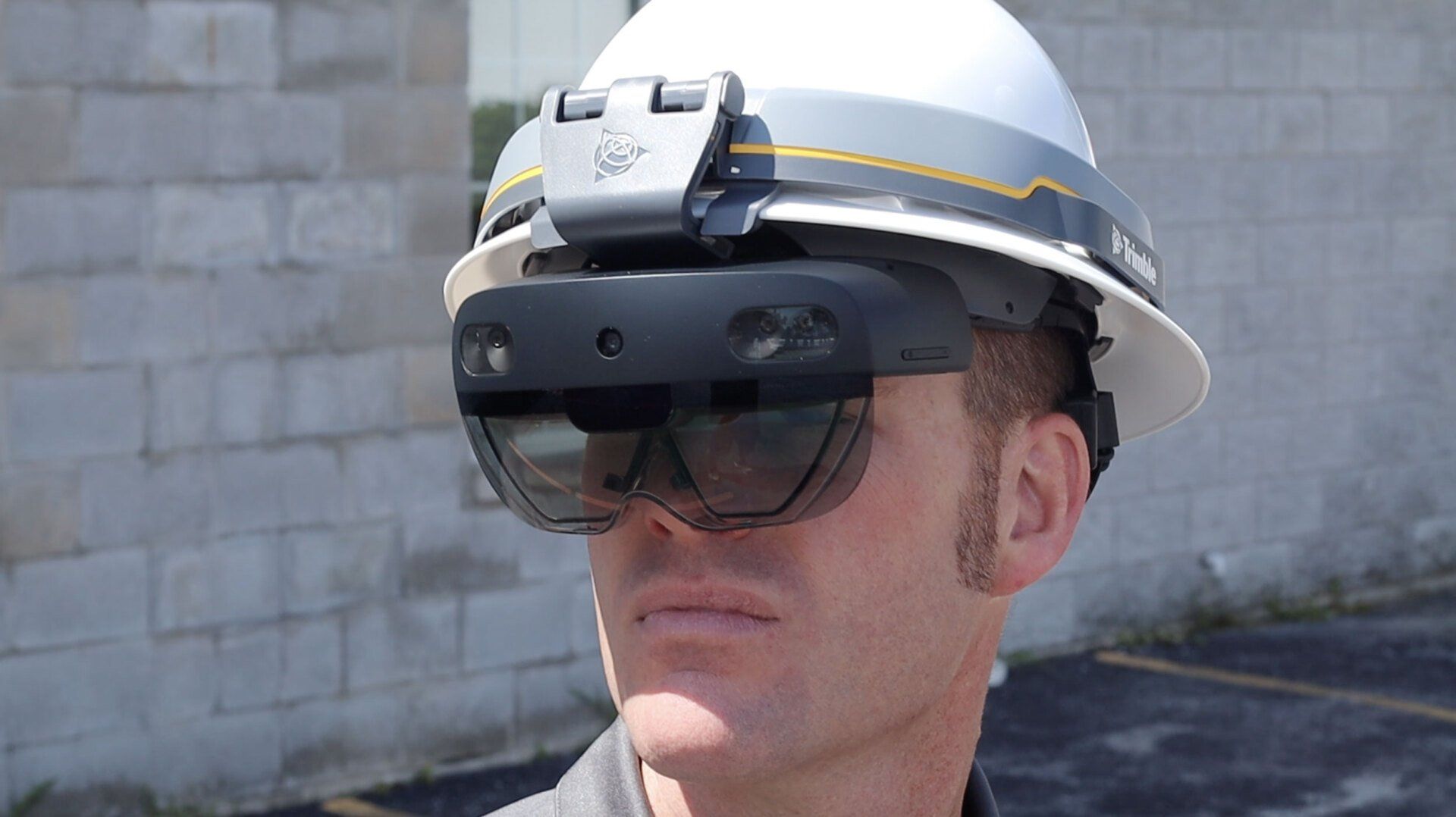 a man wearing a hard hat and virtual reality glasses