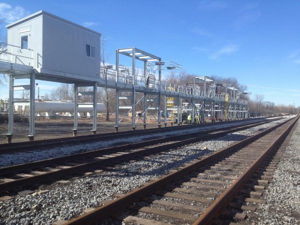 a train track with a building in the background.
