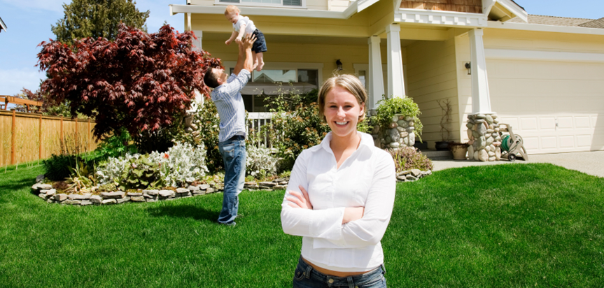 people standing in front of house