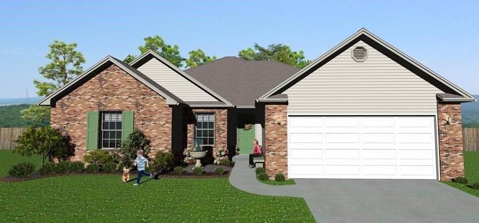 A brick house with green shutters, a garage, and a person with a dog in the yard.