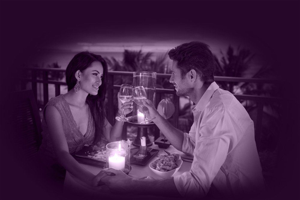 singles on a romantic date Couple having a wine together