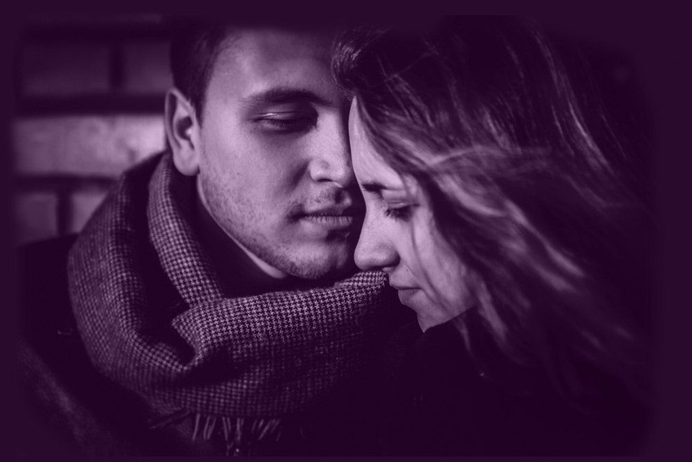 man and woman hugging