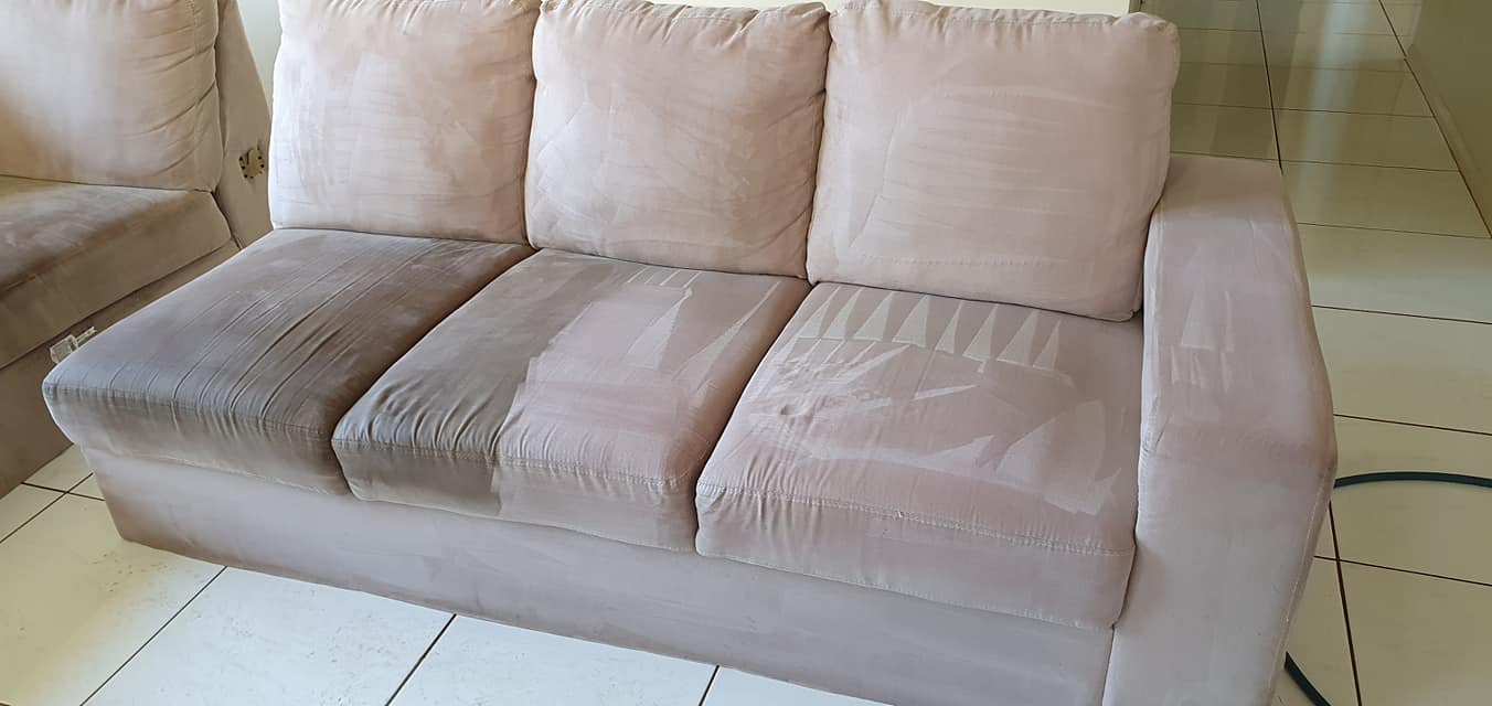 During the steam cleaning process of a lounge clean Light brown coloured lounge showing dirty and clean parts of the lounge