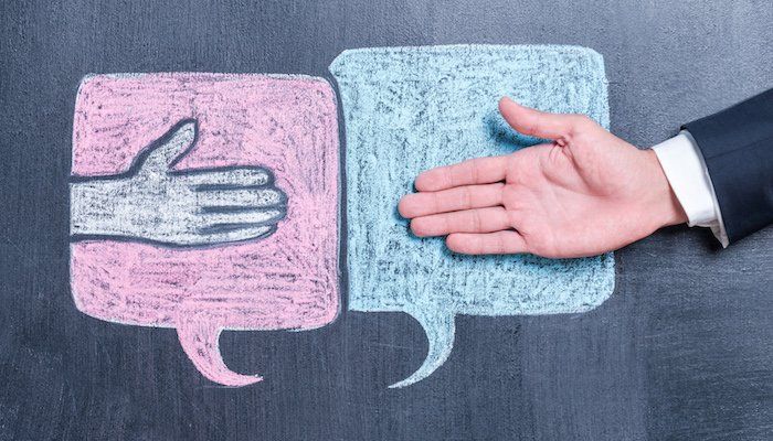 drawn hand shaking hands with a real hand