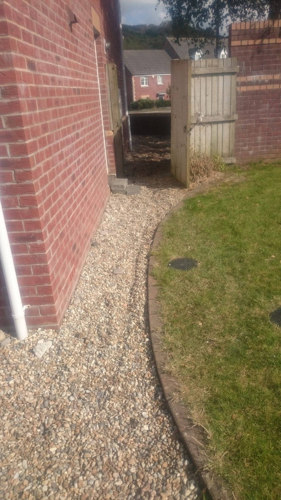 Driveway patio with garden curved
