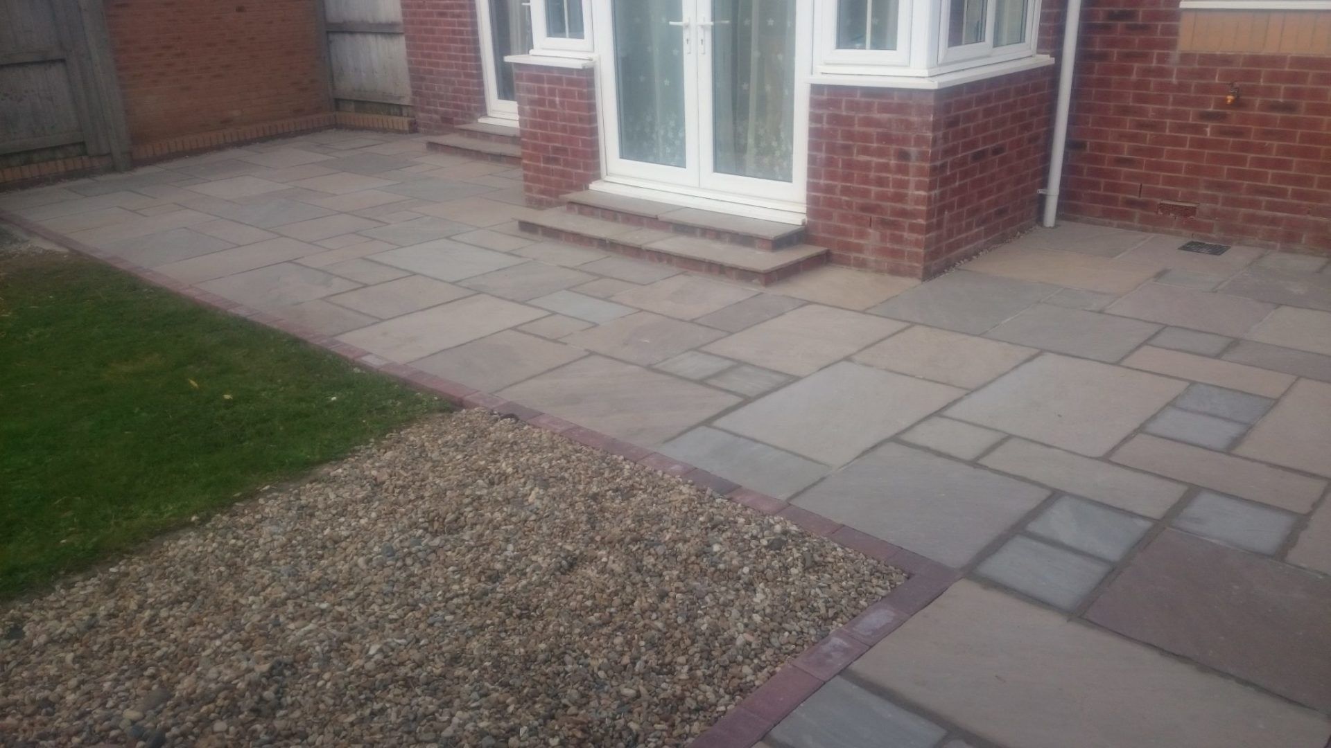 Patio tiles installed in front house