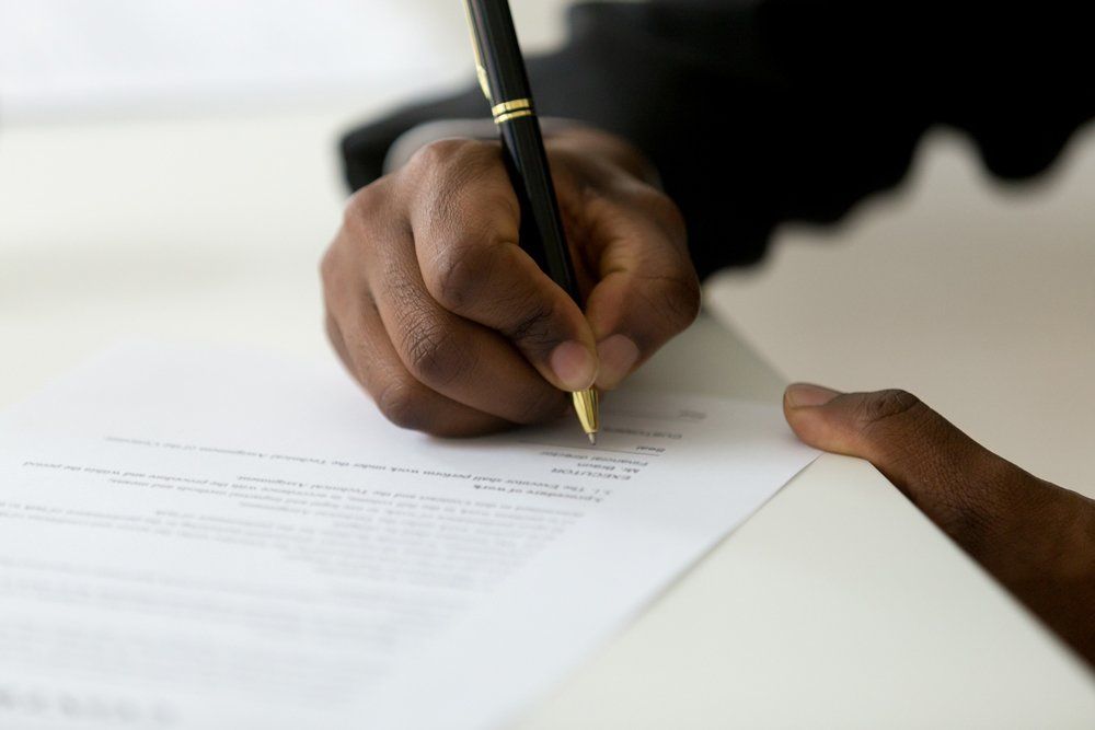 Signing On Legal Document - Post-Decree in Orland Park, IL Signing On Legal Document - Post-Decree in Orland Park, IL