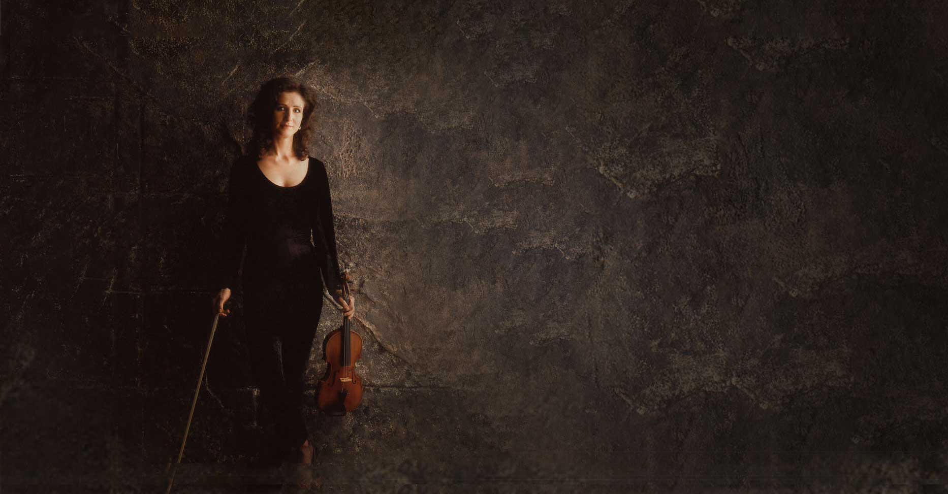madeleine mitchell against a stone wall background